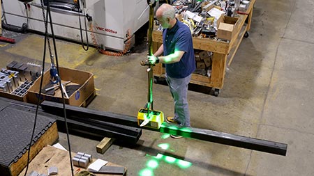Hololight dot cross used by crane operator for precise targeting with load.