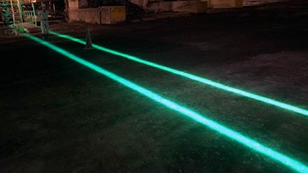 Hololight line used to create walking path in work zone.