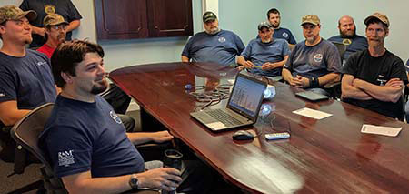 Employees sitting through a CMAA Overhead Crane Operator Certification Course.