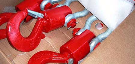 Supply of crane & hoist parts featuring clevis hooks with latch and round pin shackle.