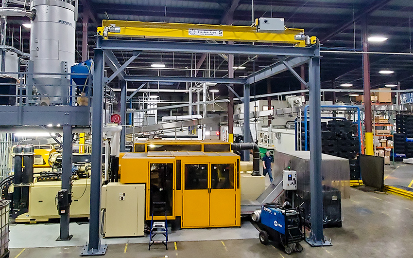 5-ton bridge crane system with custom 4-column runway for water bottle manufacturing company.