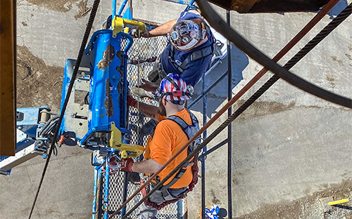 Overhead Crane Technicians Replacing Wire Rope