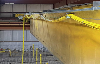 Newly installed flat cable festoon and c-track for 40 ton overhead bridge crane.