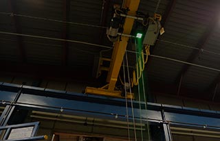 Overhead crane and hoist featuring a green LED crane safety light.
